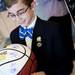 Dexter resident Connor Meadows, 11, inspects his signed  basketball before the basketball banquet on Tuesday, April 16. AnnArbor.com I Daniel Brenner